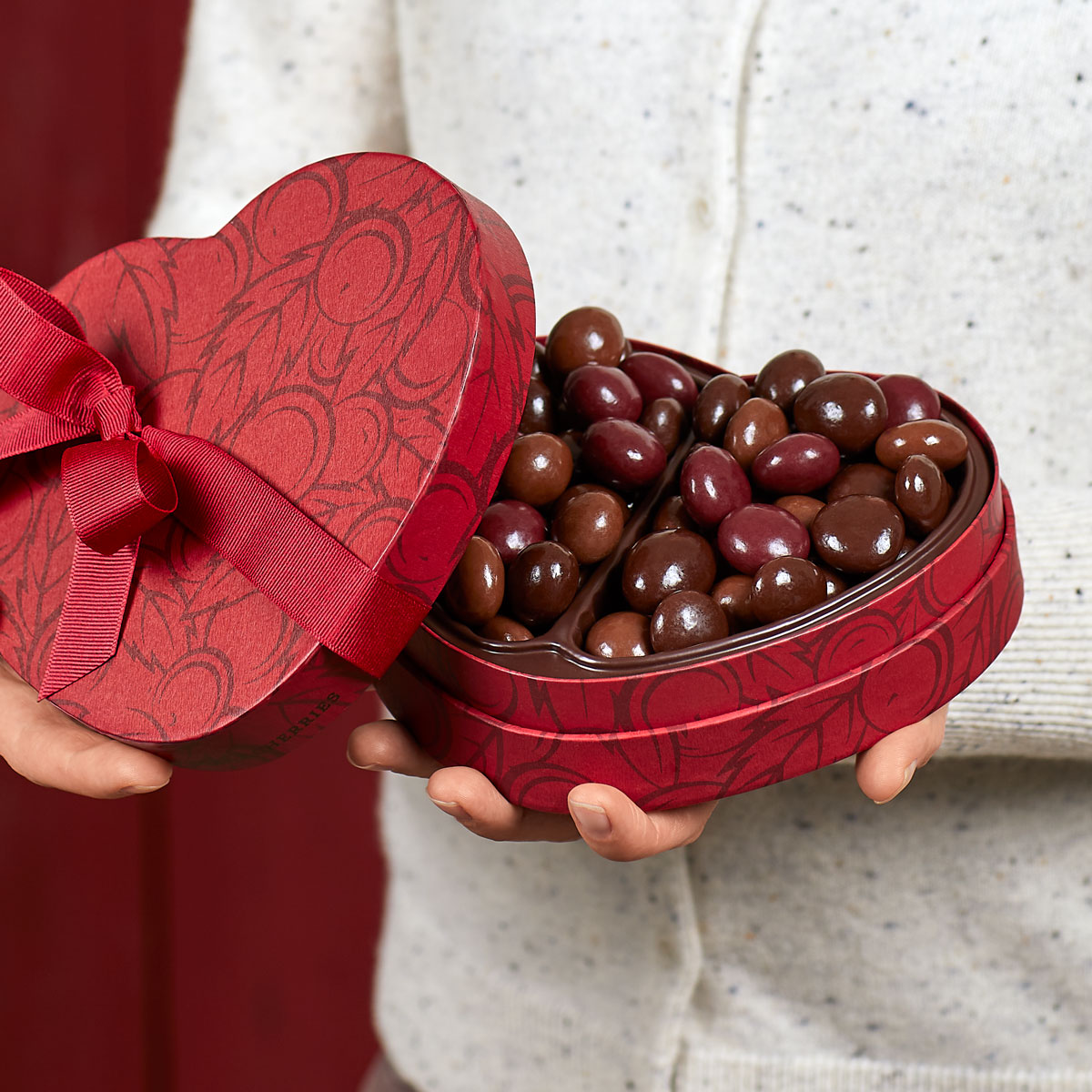 Cherry quartet heart box being gifted and opened