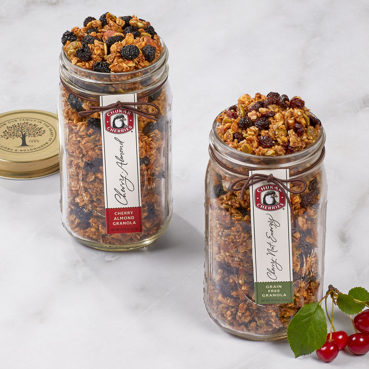 Open jars of cherry almond and grain free cherry nut energy granolas