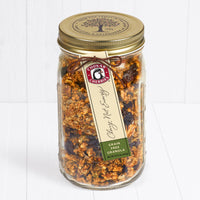 Grain free cherry nut energy granola in an open glass farm jar