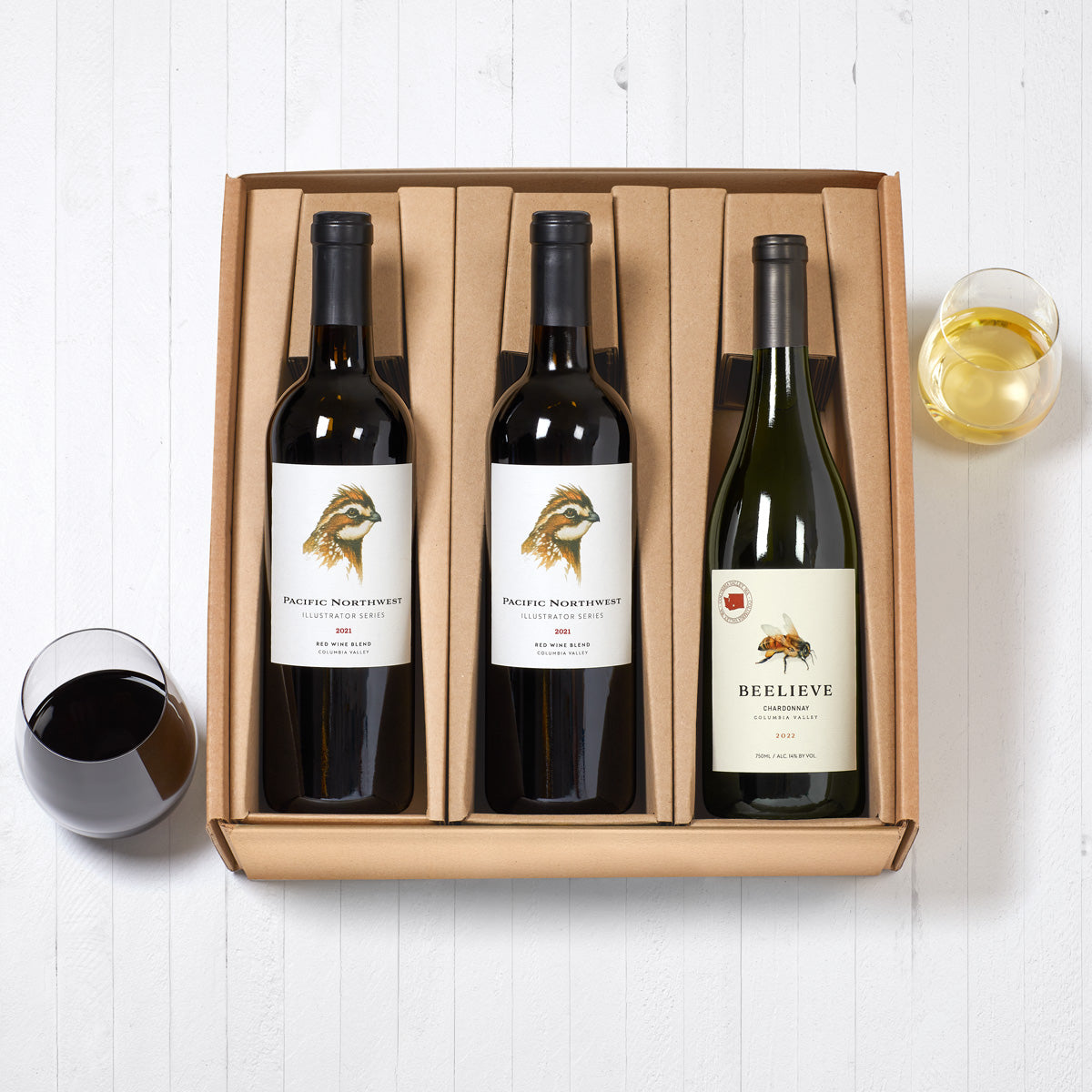 One chardonnay bottle and glass of wine, two red blend bottles and glass of wine