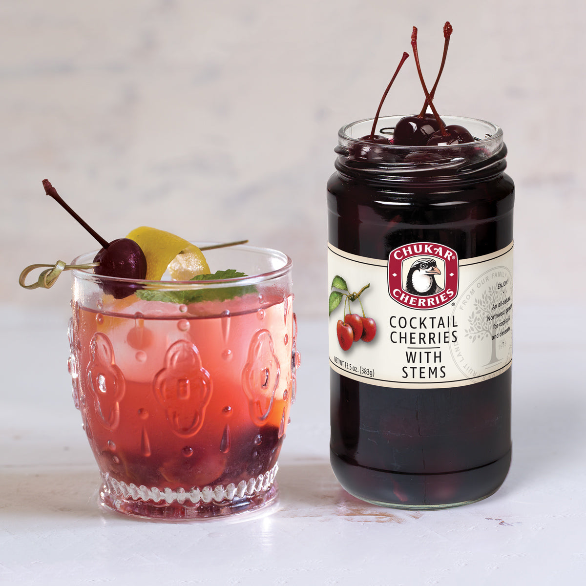 Cold drink with cocktail cherries garnish 