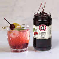 Cold drink with cocktail cherries garnish 