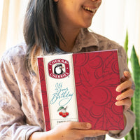 Lady smiling holding a happy birthday original assortment