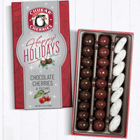 Three row happy holidays chocolate cherry classic assortment filled with milk and dark chocolate covered cherries, and milk chocolate honey pecans
