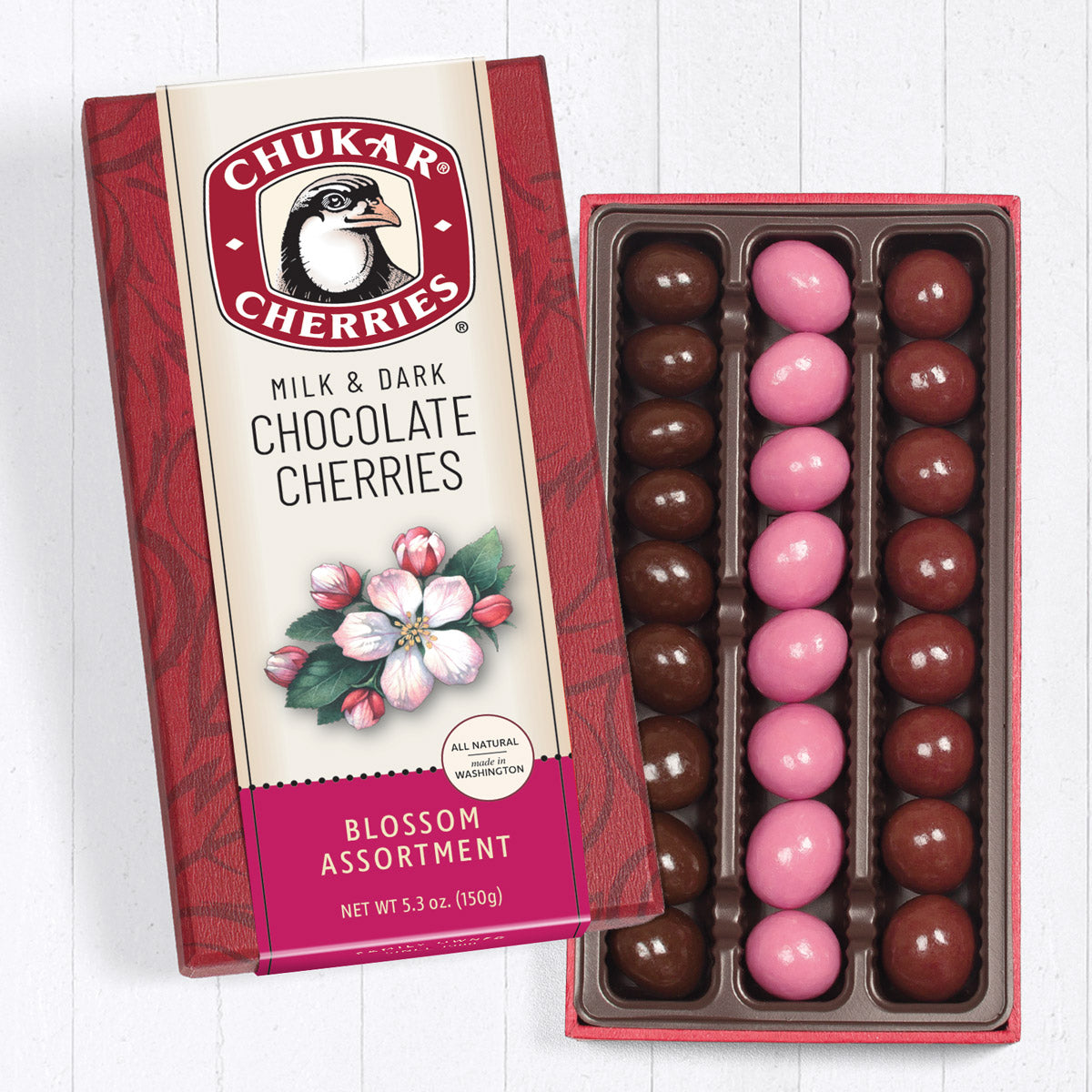 Box of Chukar Cherries milk and dark chocolate cherries on a white background