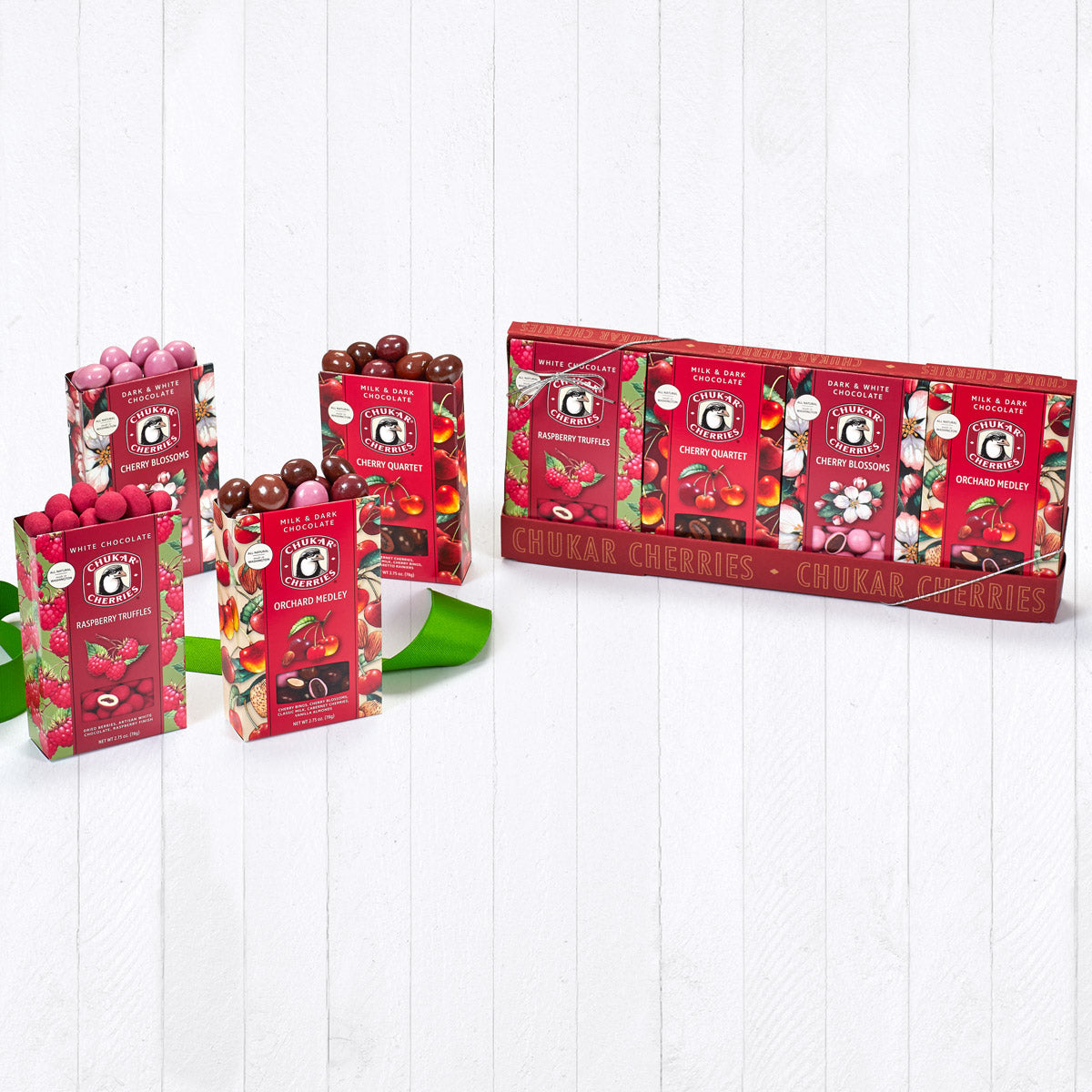 Orchard favorites four box sampler filled with chocolate covered cherries, berries, and nuts