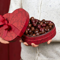 Cherry quartet heart box being gifted and opened