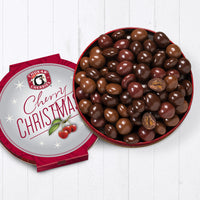 Open cherry christmas quartet tin showing whole dark chocolate cabernet cherries, milk chocolate cherry bings, classic milk chocolate cherries, and whole and cut ultra dark chocolate amaretto rainiers