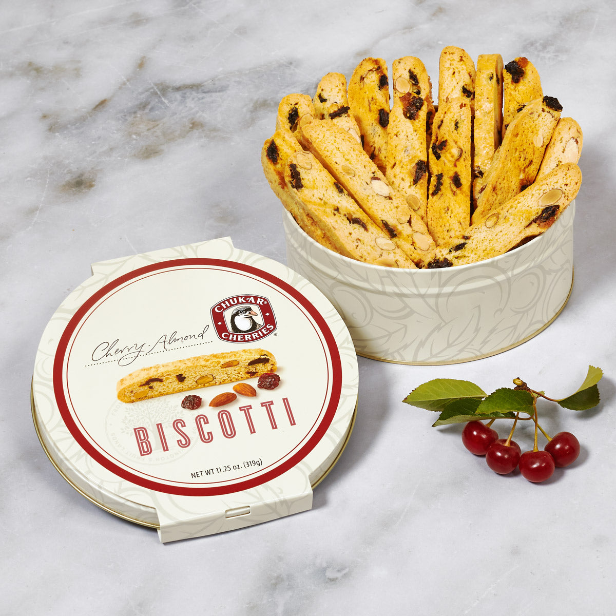 Open cream gift tin showing biscotti cookies 