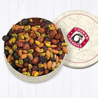 Cream color gift tin filled with triple cherry nut