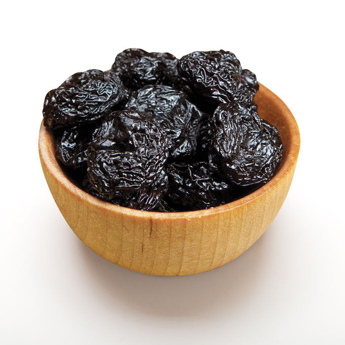 Dried bing cherries in wood bowl
