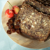 Nutty quick bread garnished with dried and fresh Rainier cherries
