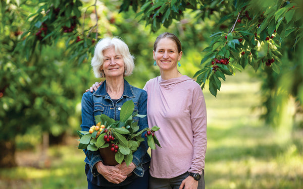 Pam and daughter in cherry orchard