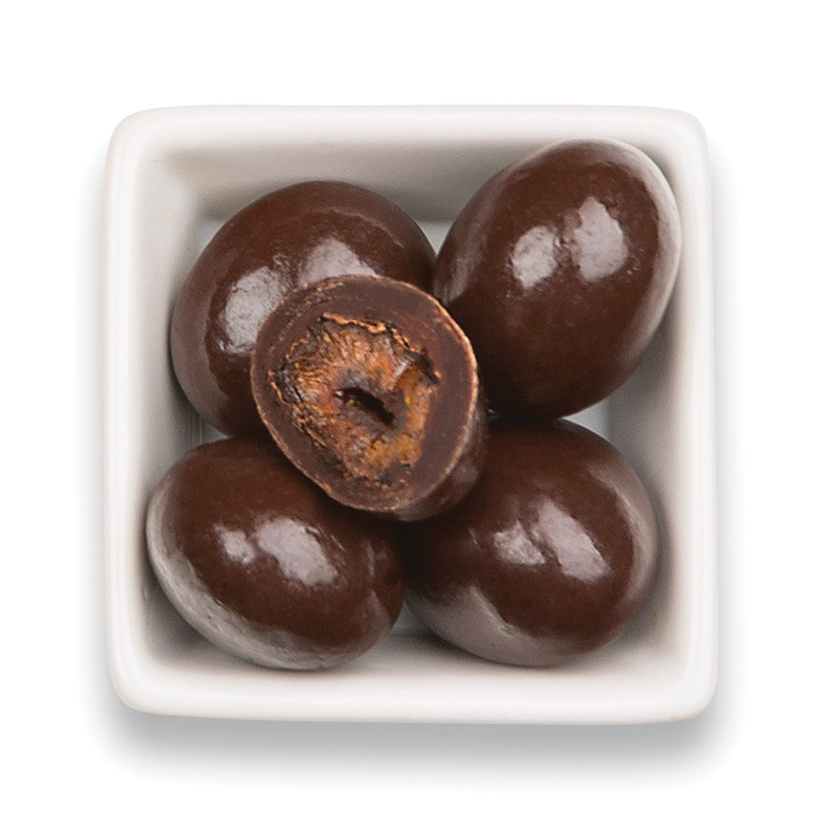 Whole and cut usda organic chocolate chipotle cherries in white bowl