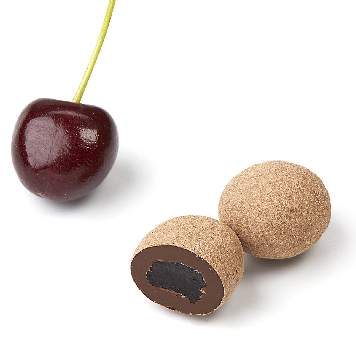 Fresh cherry and cross-section of chocolate covered dried cherry