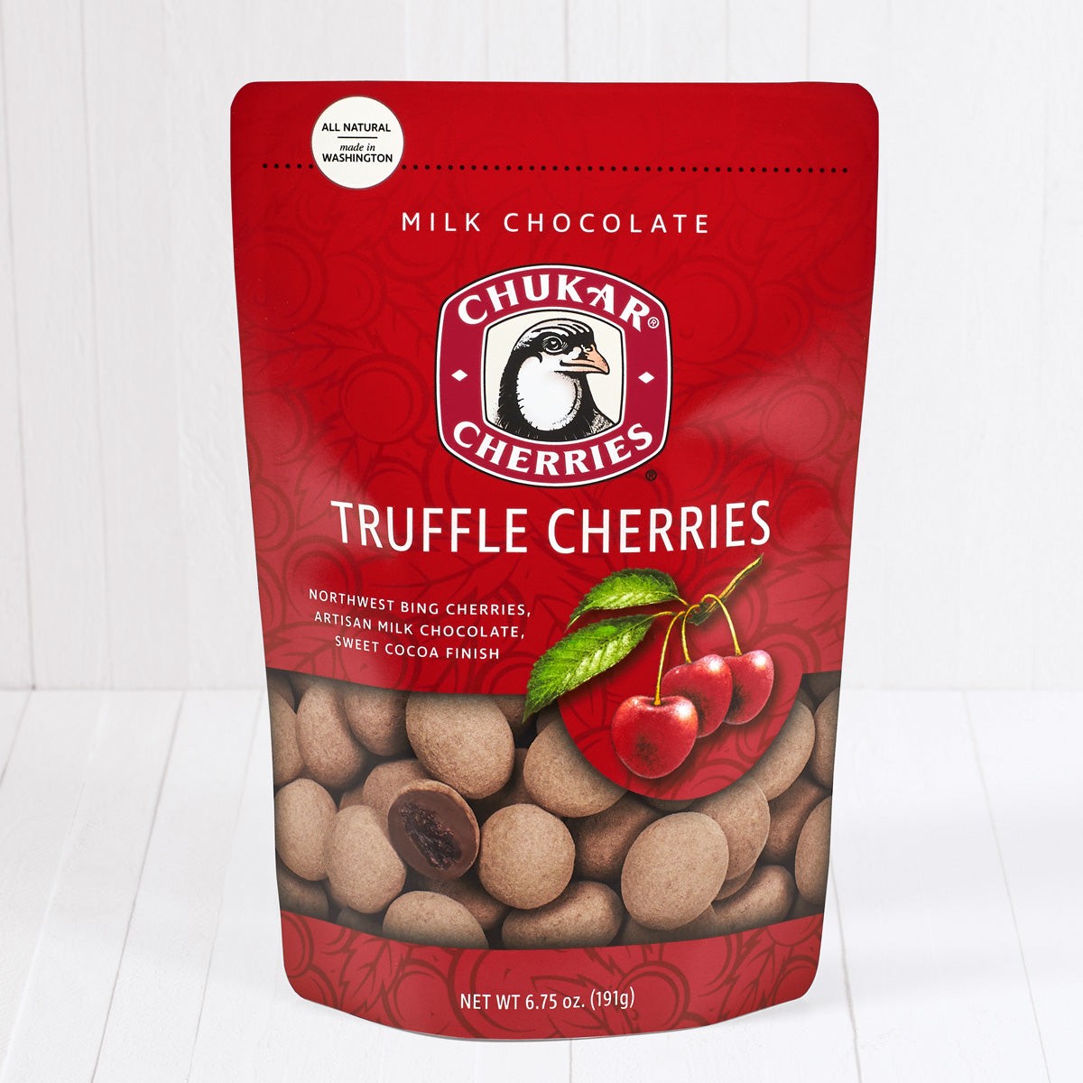 Whole and cut milk chocolate truffle cherries shown in closed resealable bag