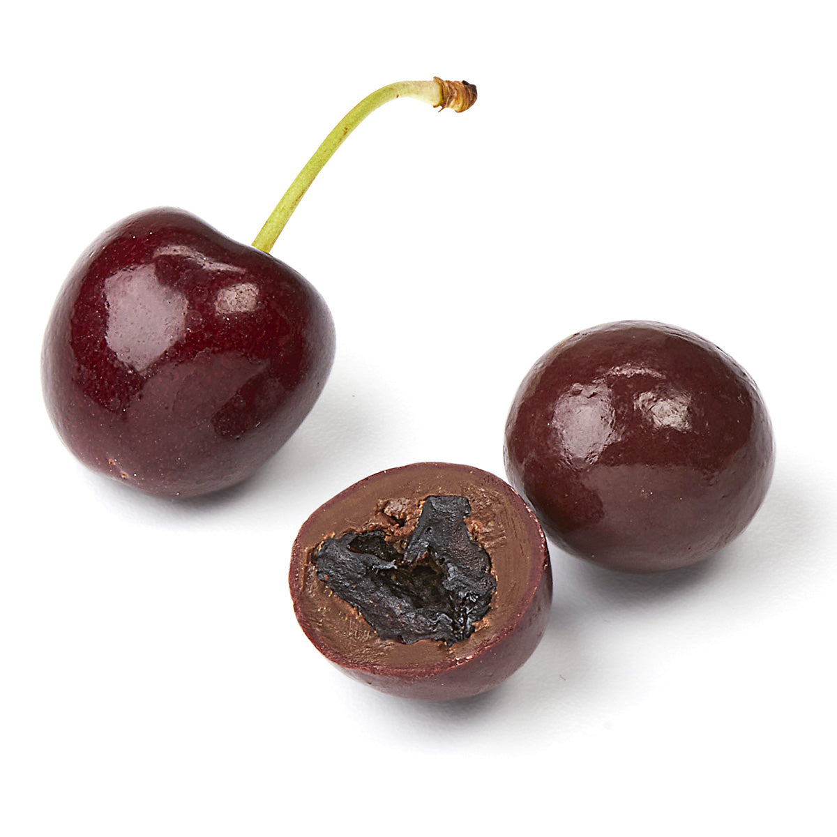 Fresh cherry and cross-section of chocolate covered dried cherry