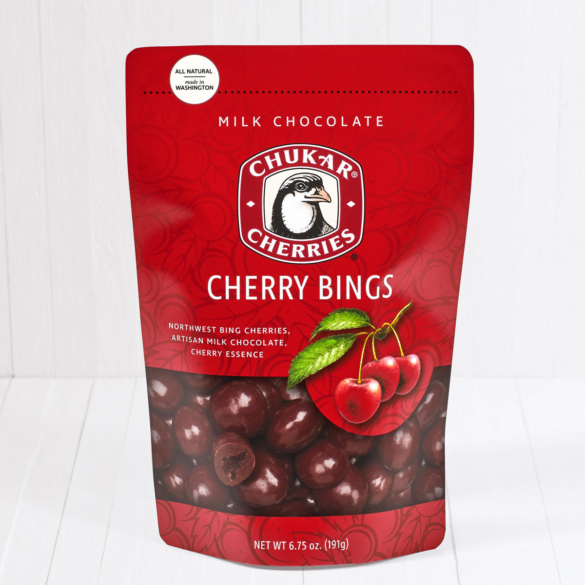Whole and cut milk chocolate cherry bings shown in closed resealable bag