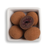 Whole and cut black forest cherries in bowl