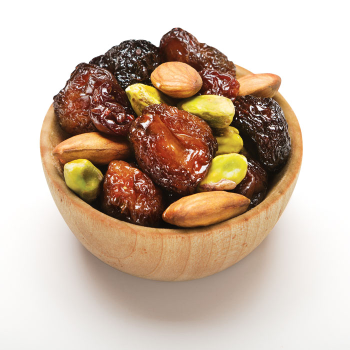 Triple cherry nut fruit and nut mix in wood bowl