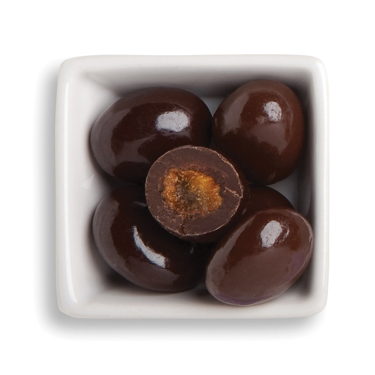 Whole amaretto rainiers, cabernet, and cut classic dark cherry in white bowl