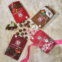 Bags and spills of classic milk chocolate cherries, honey pecans, white and dark chocolate cherry blossoms, and classic dark chocolate cherries  