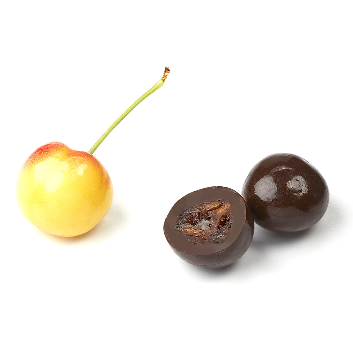 Fresh cherry and cut chocolate covered cherry