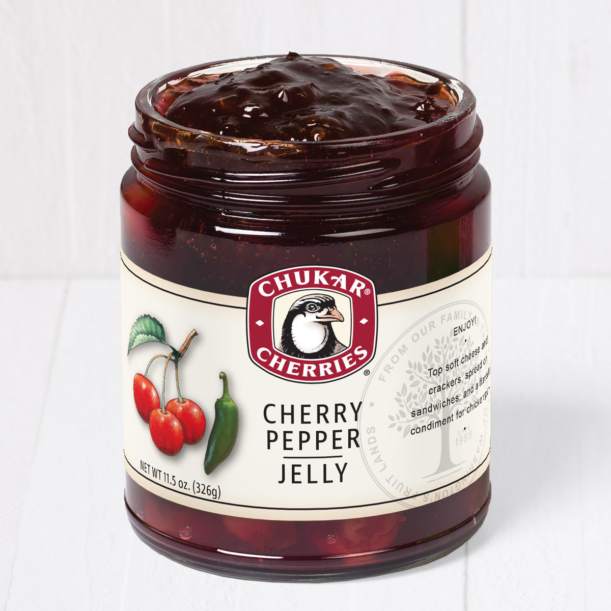 Open jar of cherry pepper jelly
