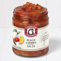 Open jar of peach cherry salsa