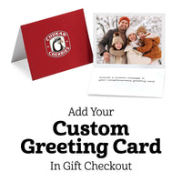 Complimentary greeting card example with image of family of four dressed for winter with snowy trees background