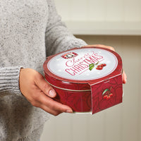 Cherry chrismas tin being presented