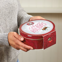 Happy holidays tin being presented