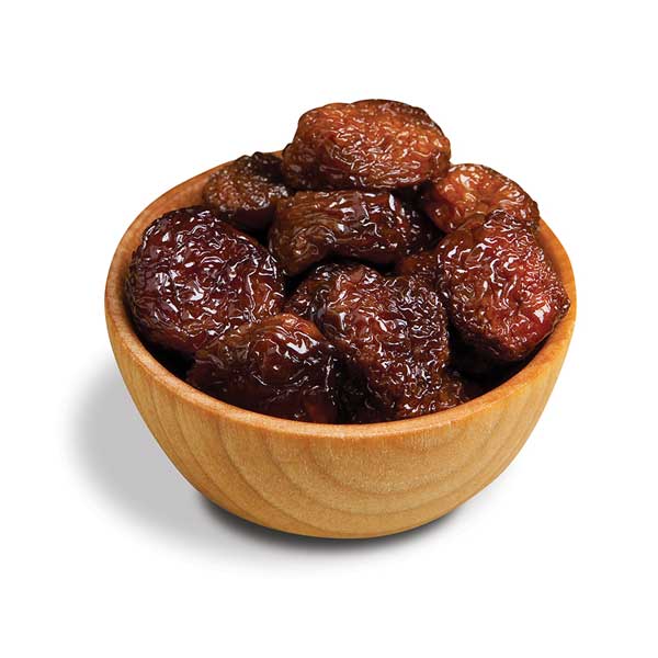 Dried rainier cherries in wood bowl