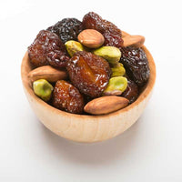 Triple cherry nut fruit and nut mix in a wood bowl